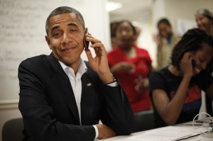 President Barack Obama reacts after realizing he dialed the wrong number while making calls from a local campaign field office during a unscheduled visit, Sunday, Oct. 28, 2012 in Orlando, Fla. (AP Photo/Pablo Martinez Monsivais)